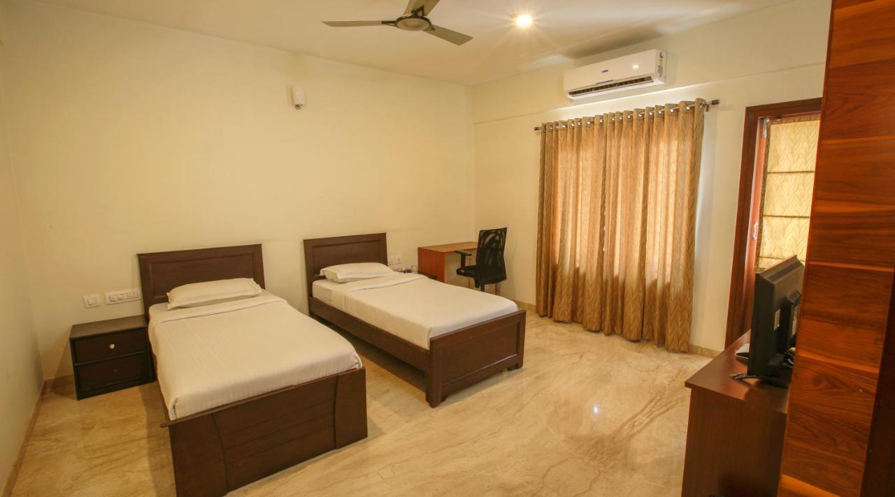 Falcon Suites Yelahanka New Town Бангалор Экстерьер фото